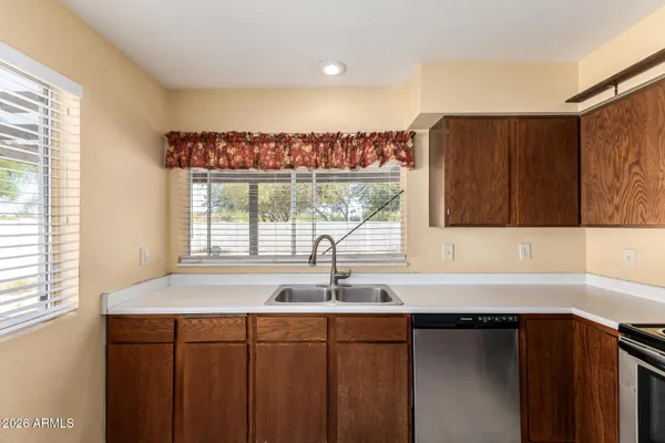 a kitchen with a sink and a window