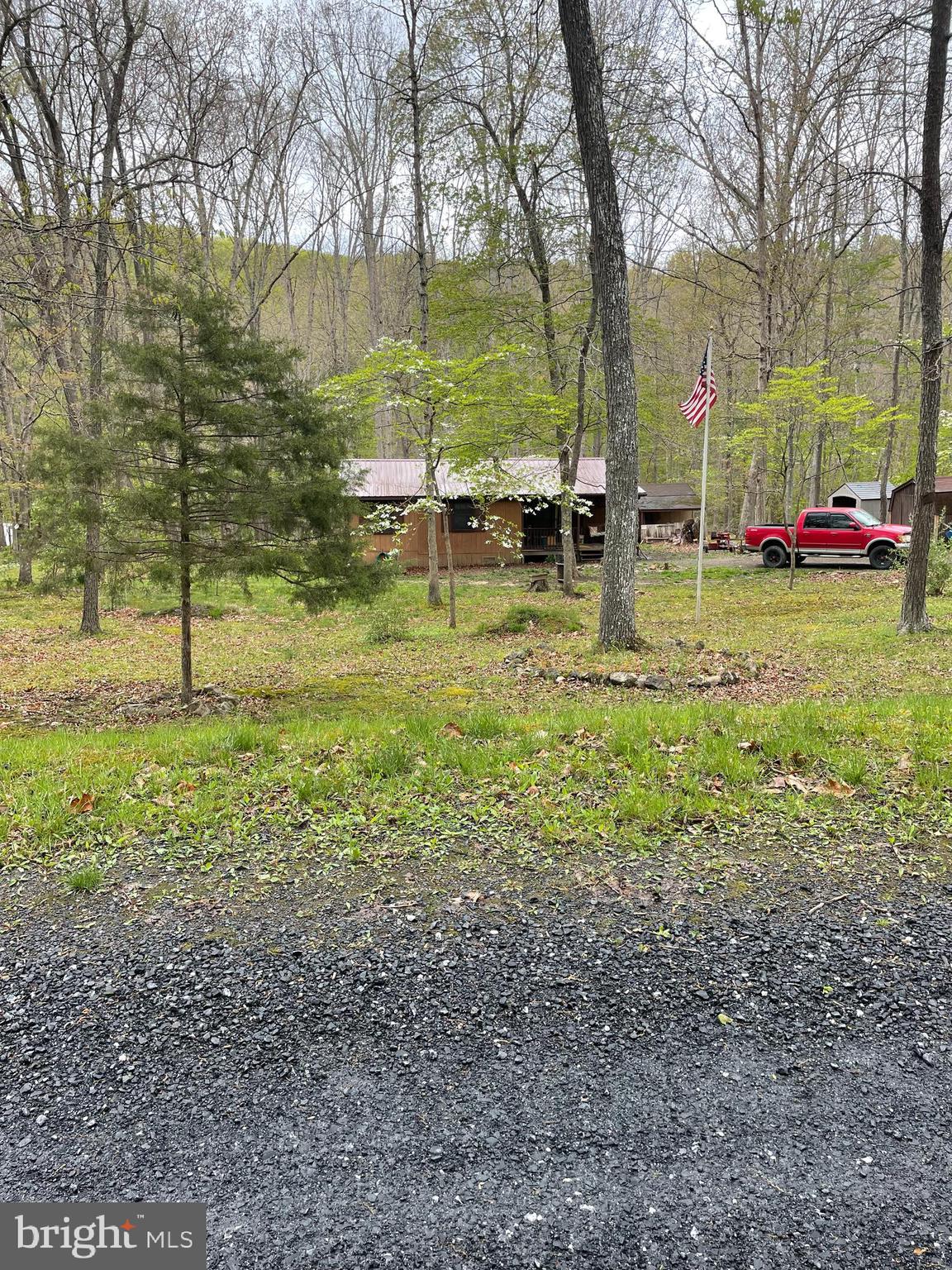 462 Trout Stream Road Lost City, WV 26810 - Photo 6 of 16 a backyard of a house with lots of green space