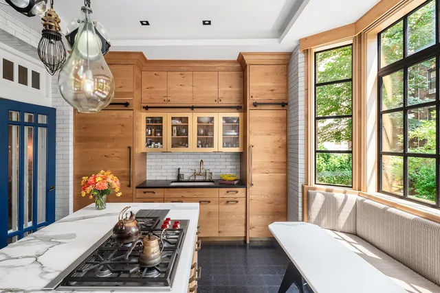 a dining table with chairs and window