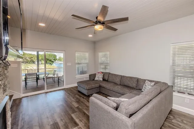 a view of an entryway with wooden floor