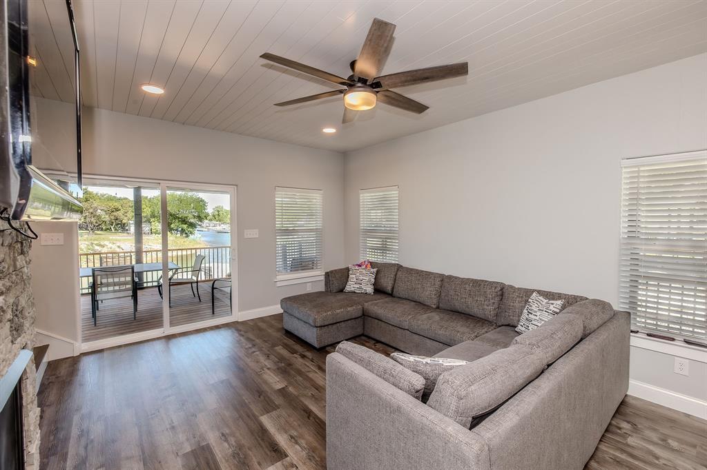 1525 McAdams Road, Unit C Graford, TX 76449 - Photo 13 of 38 Comfy living room with easy access to the back deck.