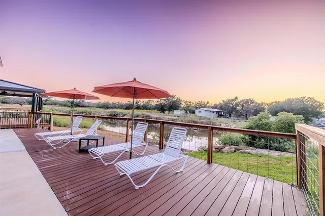 a view of a chairs and tables in patio