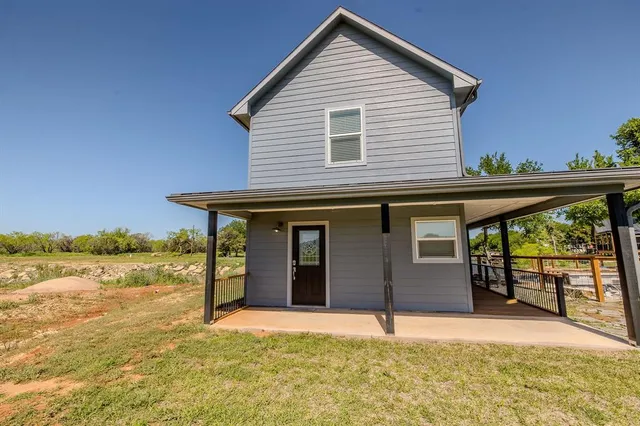 a house view with a backyard space