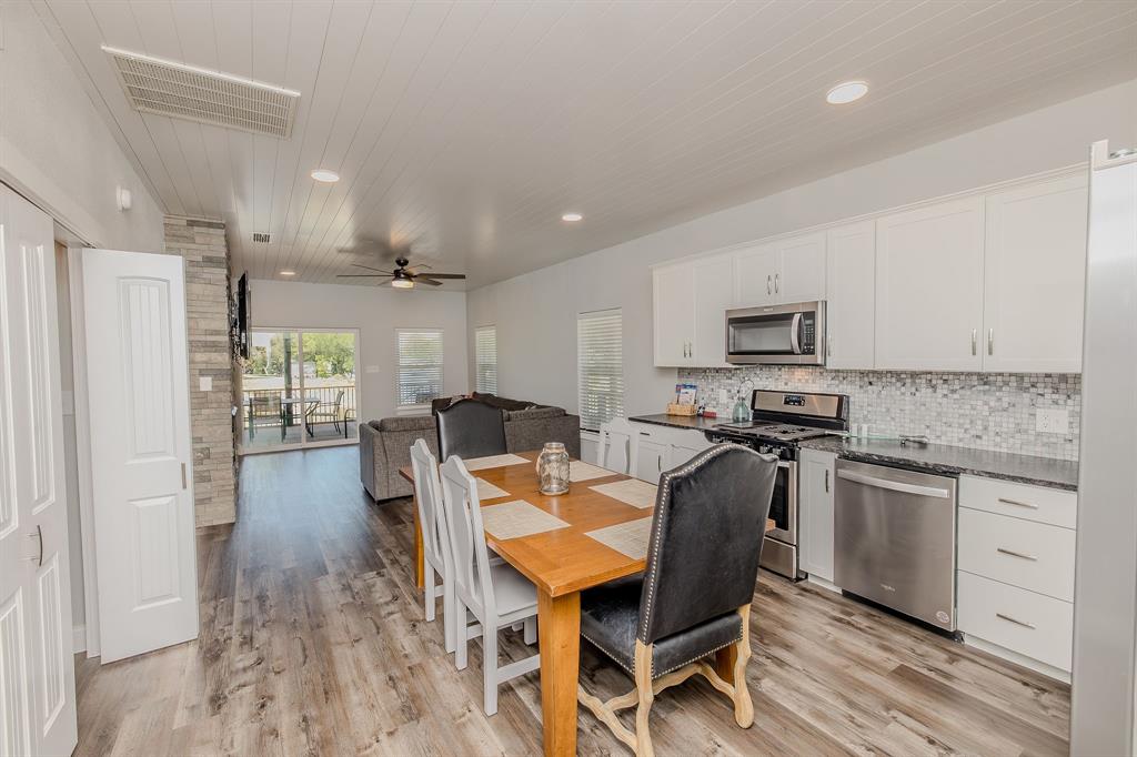 1525 McAdams Road, Unit C Graford, TX 76449 - Photo 37 of 38 View upon entry; open floor plan with a water view; laundry closet to the left