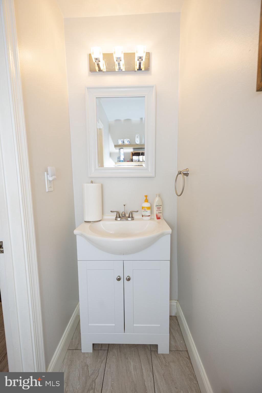 6113 Ross Street Philadelphia, PA 19144 - Photo 12 of 40 a bathroom with a sink and a mirror