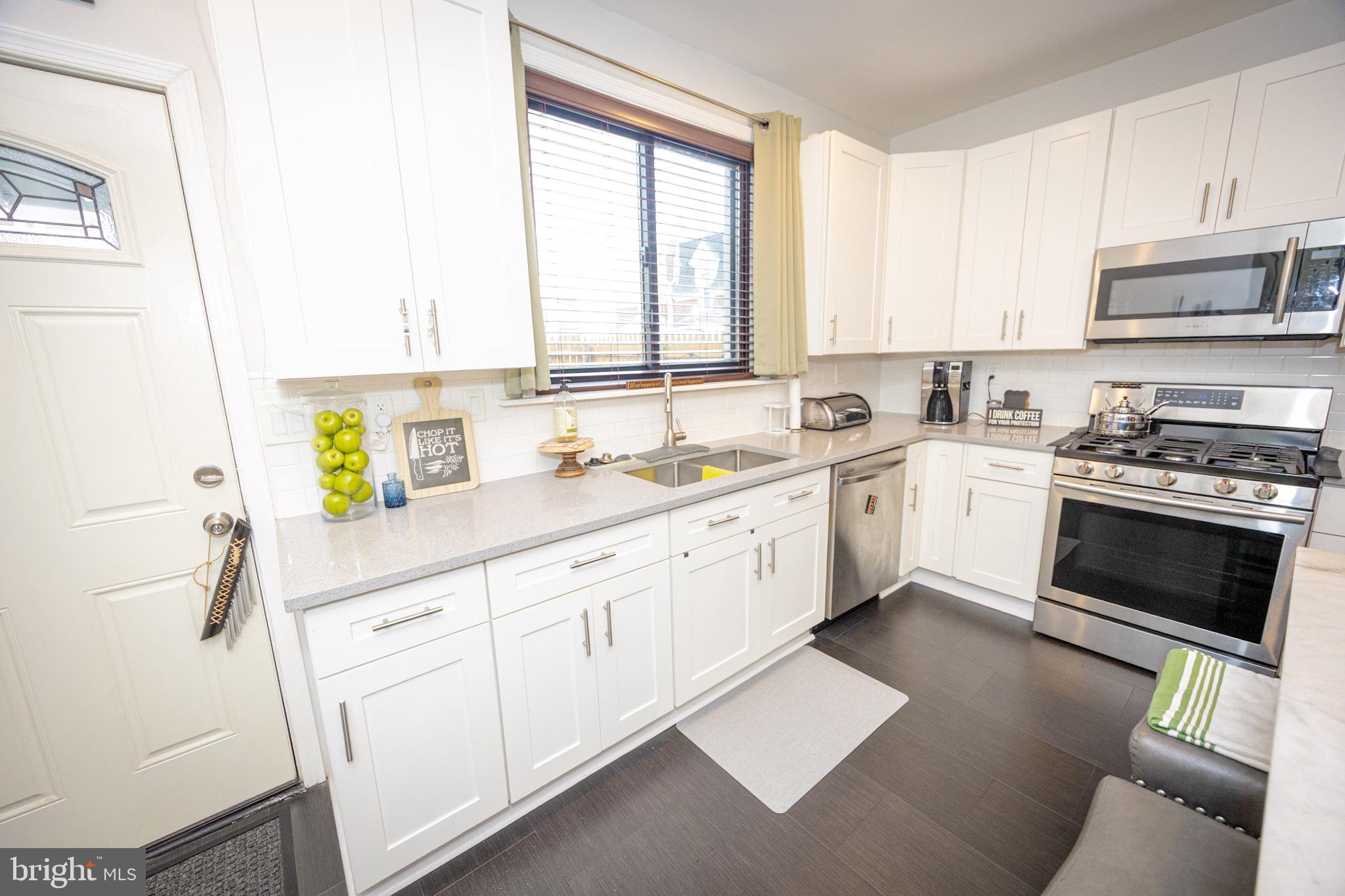 6113 Ross Street Philadelphia, PA 19144 - Photo 15 of 40 a kitchen with a sink cabinets and window