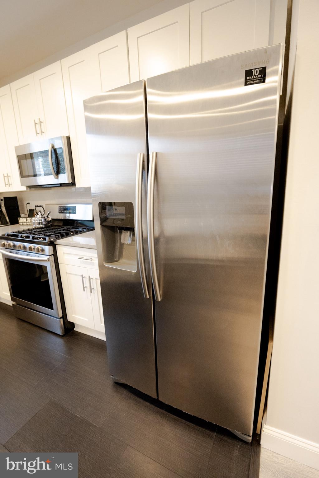 6113 Ross Street Philadelphia, PA 19144 - Photo 19 of 40 a close view of a refrigerator in kitchen and a window