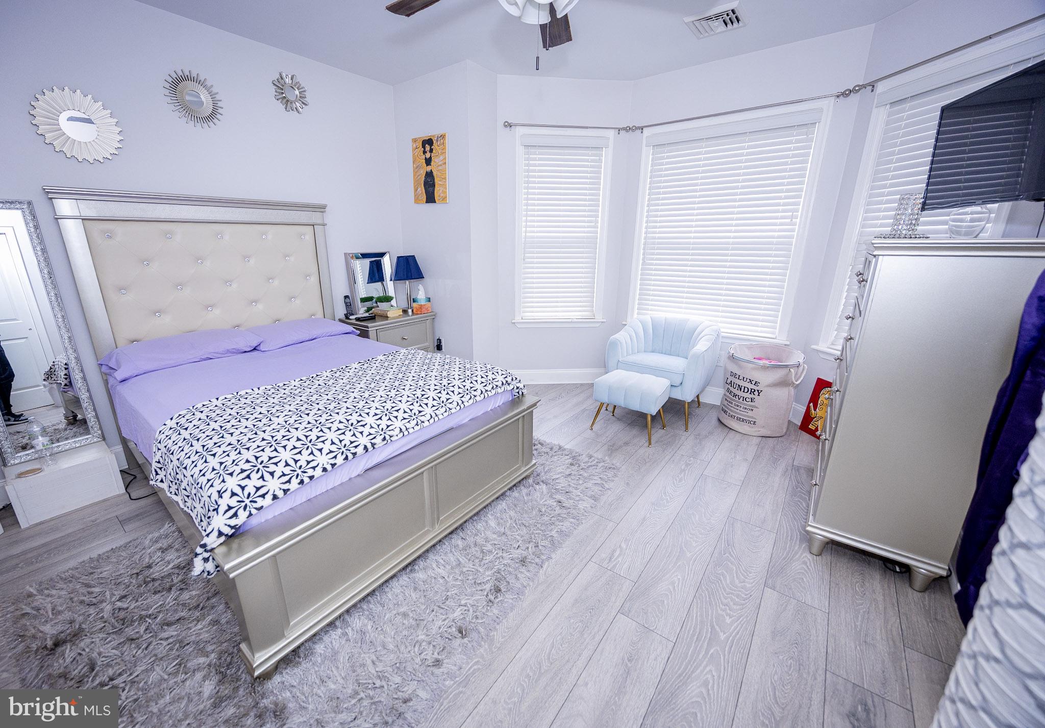 6113 Ross Street Philadelphia, PA 19144 - Photo 24 of 40 a bedroom with a bed and wooden floor