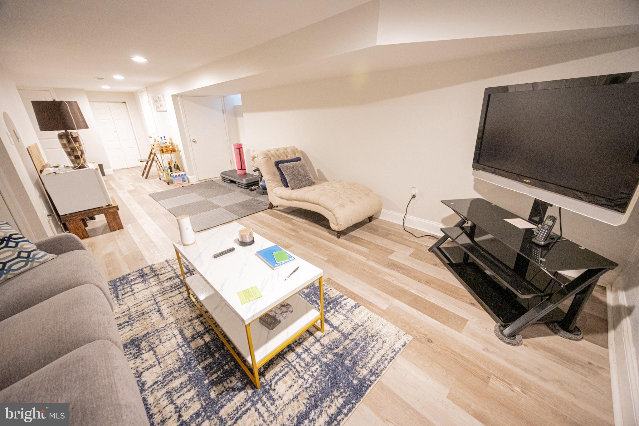 6113 Ross Street Philadelphia, PA 19144 - Photo 33 of 40 a bedroom with a bed and a flat screen tv