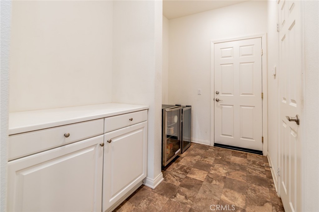 7908 Zona Court Riverside, CA 92507 - Photo 19 of 53 Kitchen cabinets (L) and pantry on the right