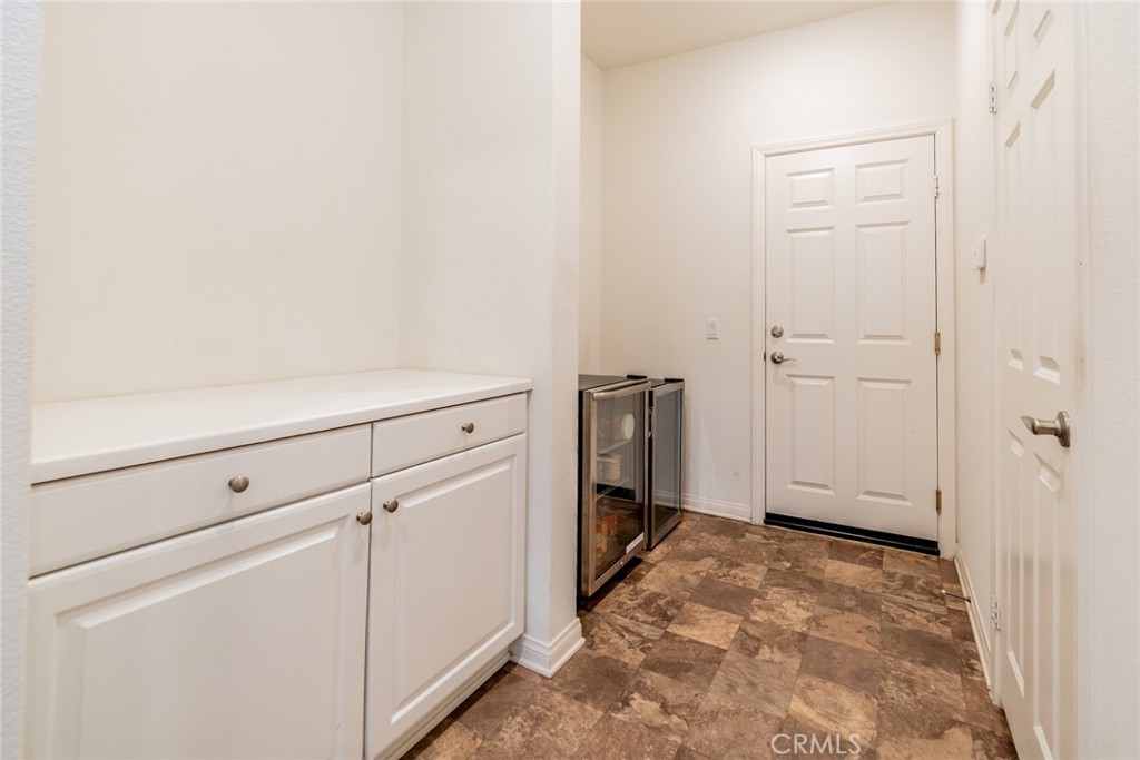 7908 Zona Court Riverside, CA 92507 - Photo 20 of 64 Kitchen cabinets (L) and pantry on the right