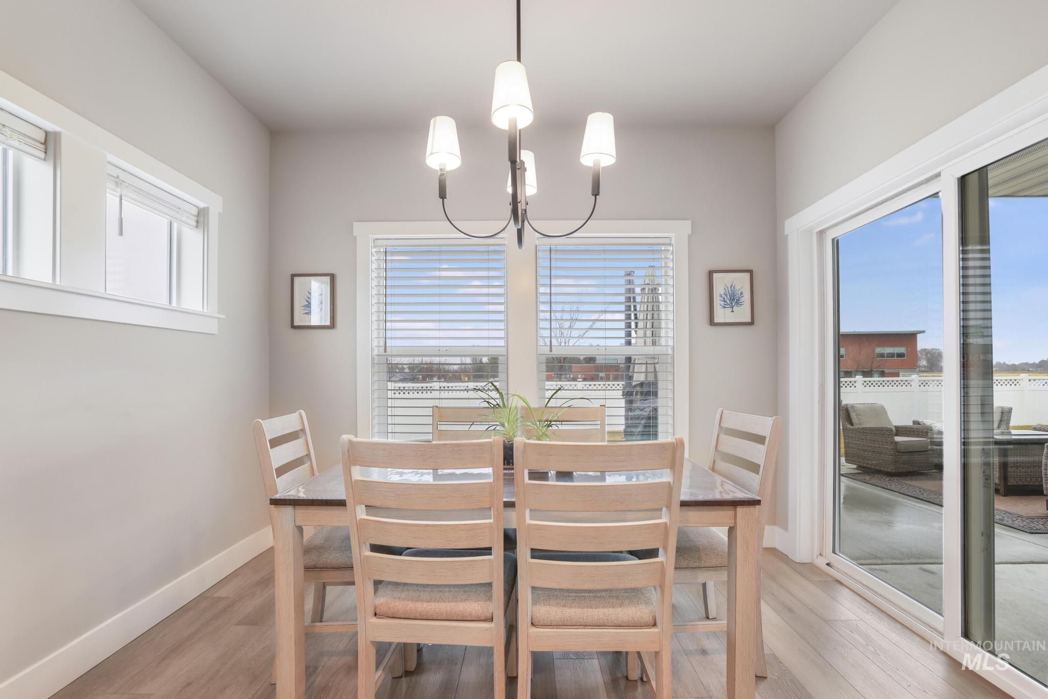 3103 Moonrise Road Twin Falls, ID 83301 - Photo 12 of 40 Dining room with light wood-type flooring and hanging lights