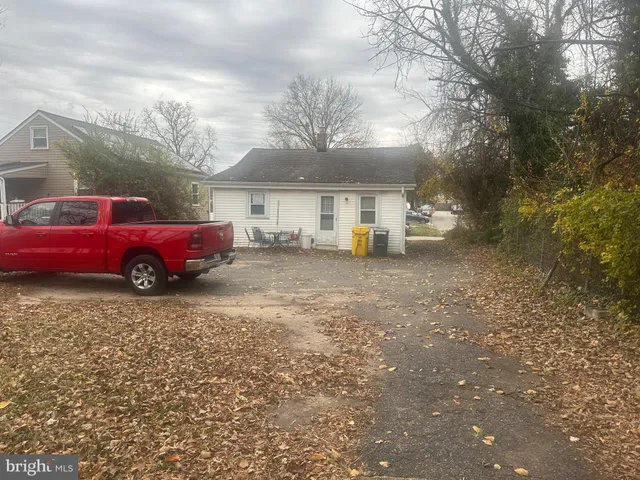 a front view of a house with parking space
