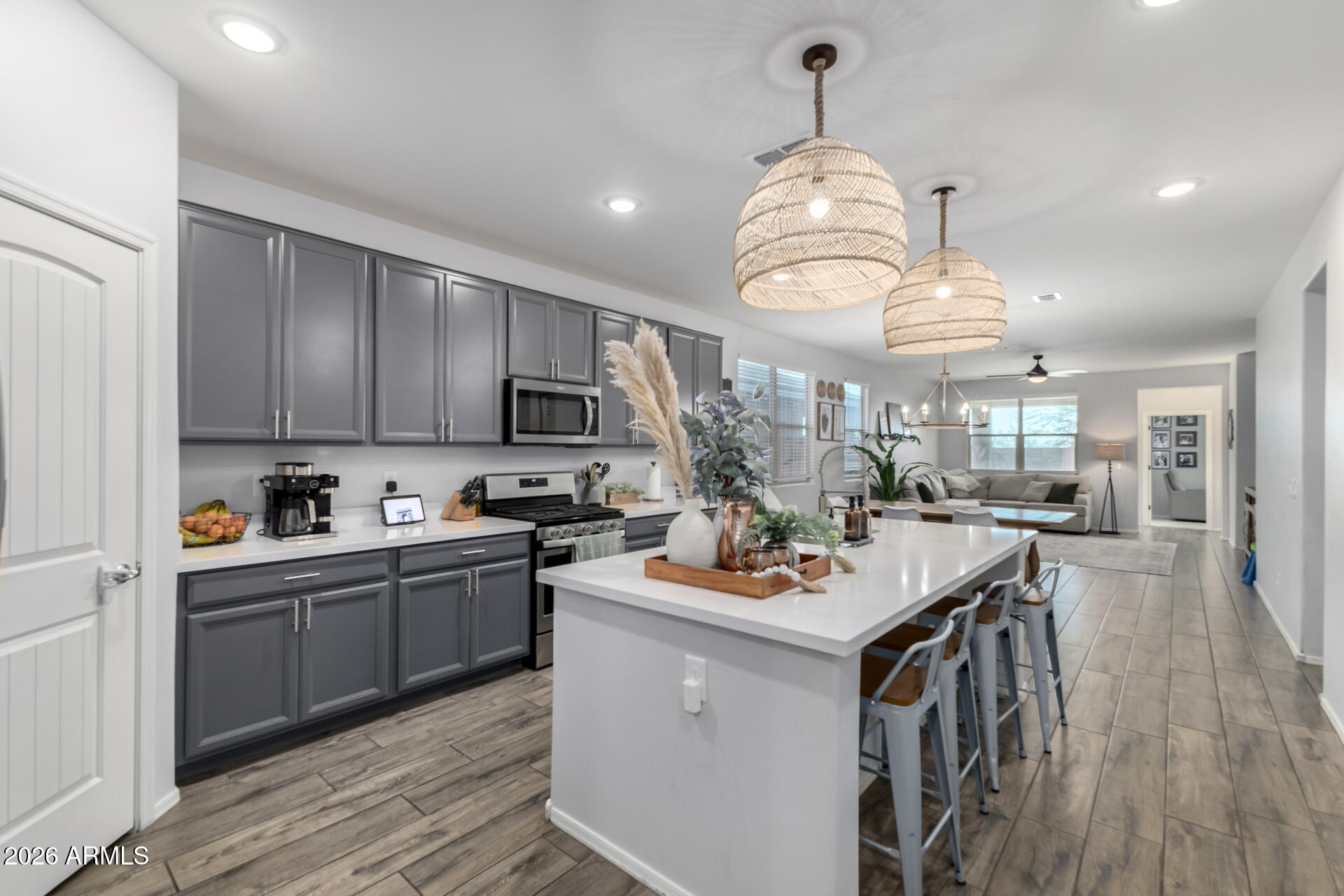 2929 West Laredo Lane Phoenix, AZ 85085 - Photo 11 of 28 a kitchen with a sink stove and cabinets