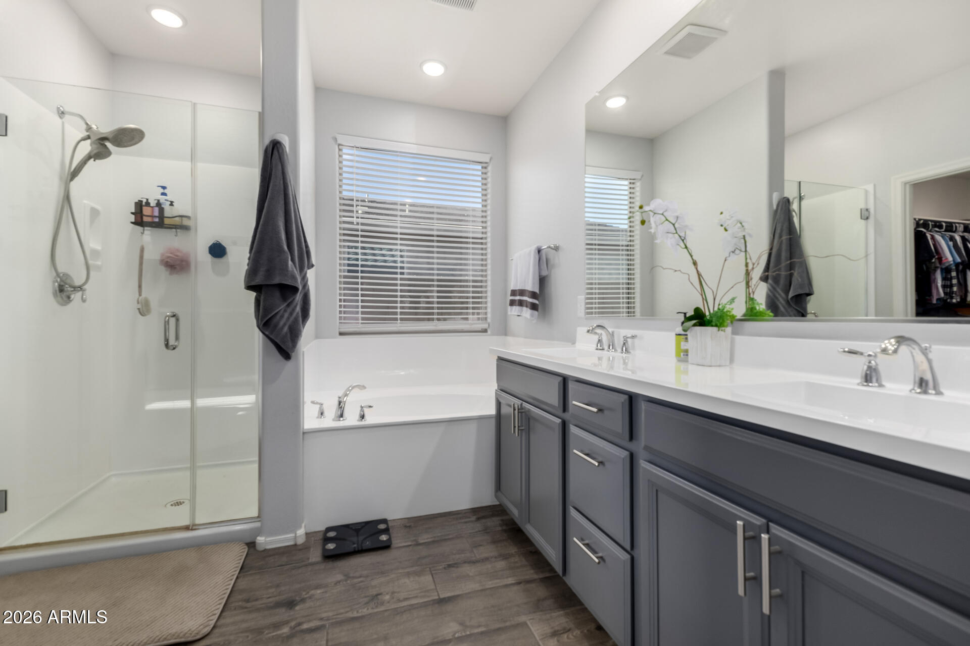 2929 West Laredo Lane Phoenix, AZ 85085 - Photo 15 of 28 a bathroom with a double vanity sink mirror and shower