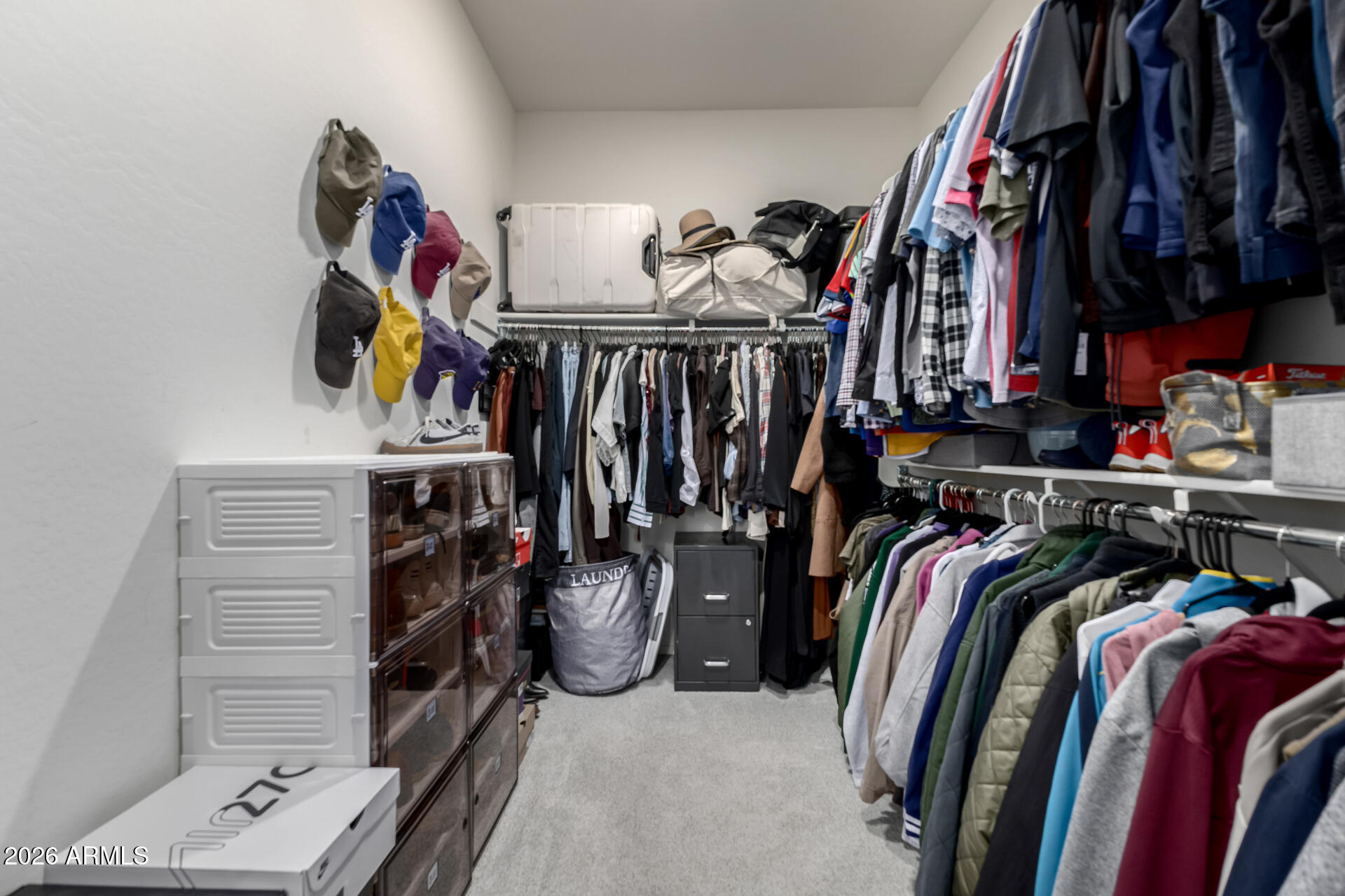 2929 West Laredo Lane Phoenix, AZ 85085 - Photo 16 of 28 a view of walk in closet with clothes and shoes