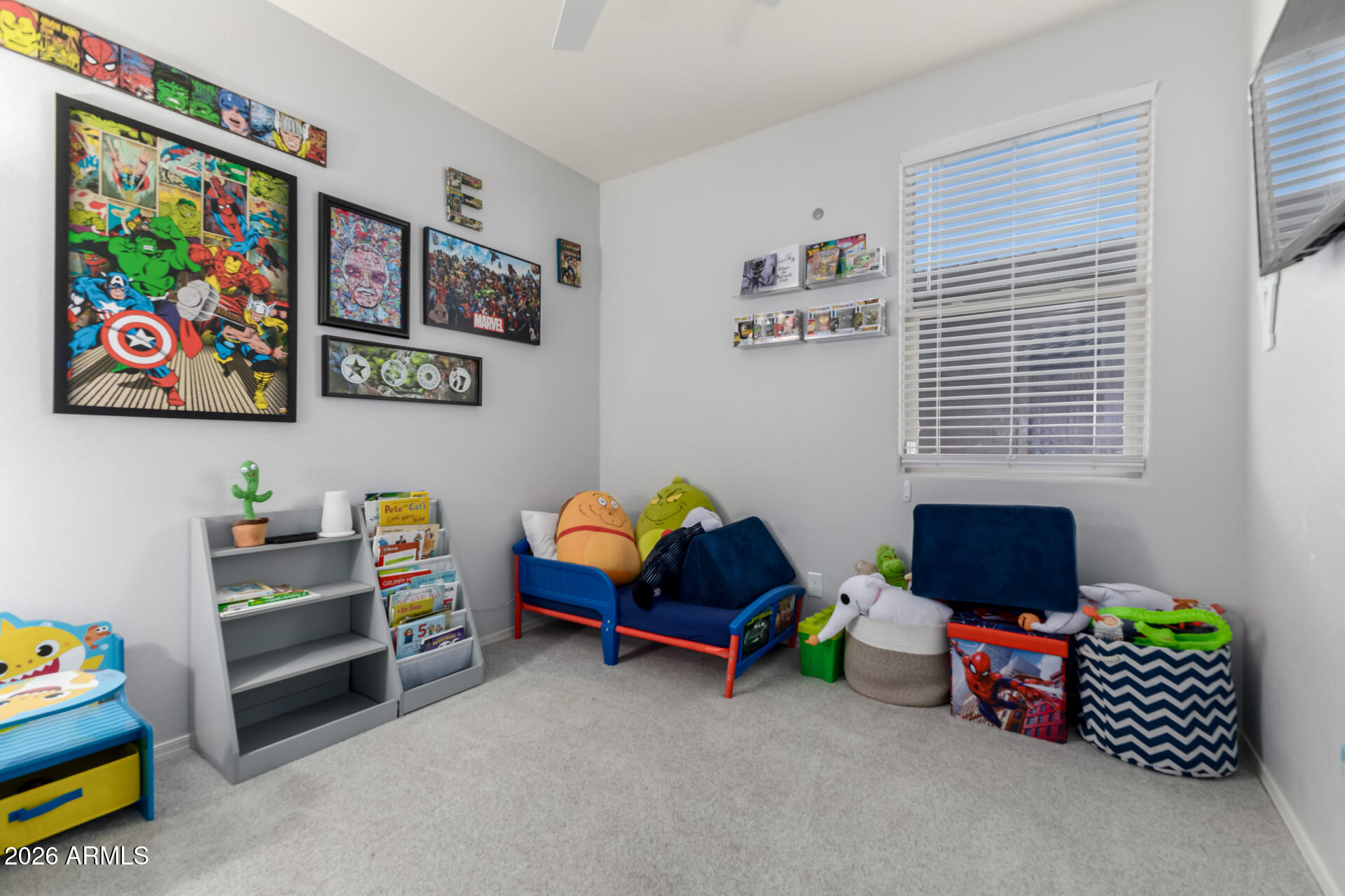2929 West Laredo Lane Phoenix, AZ 85085 - Photo 19 of 28 a bedroom with toys and a window