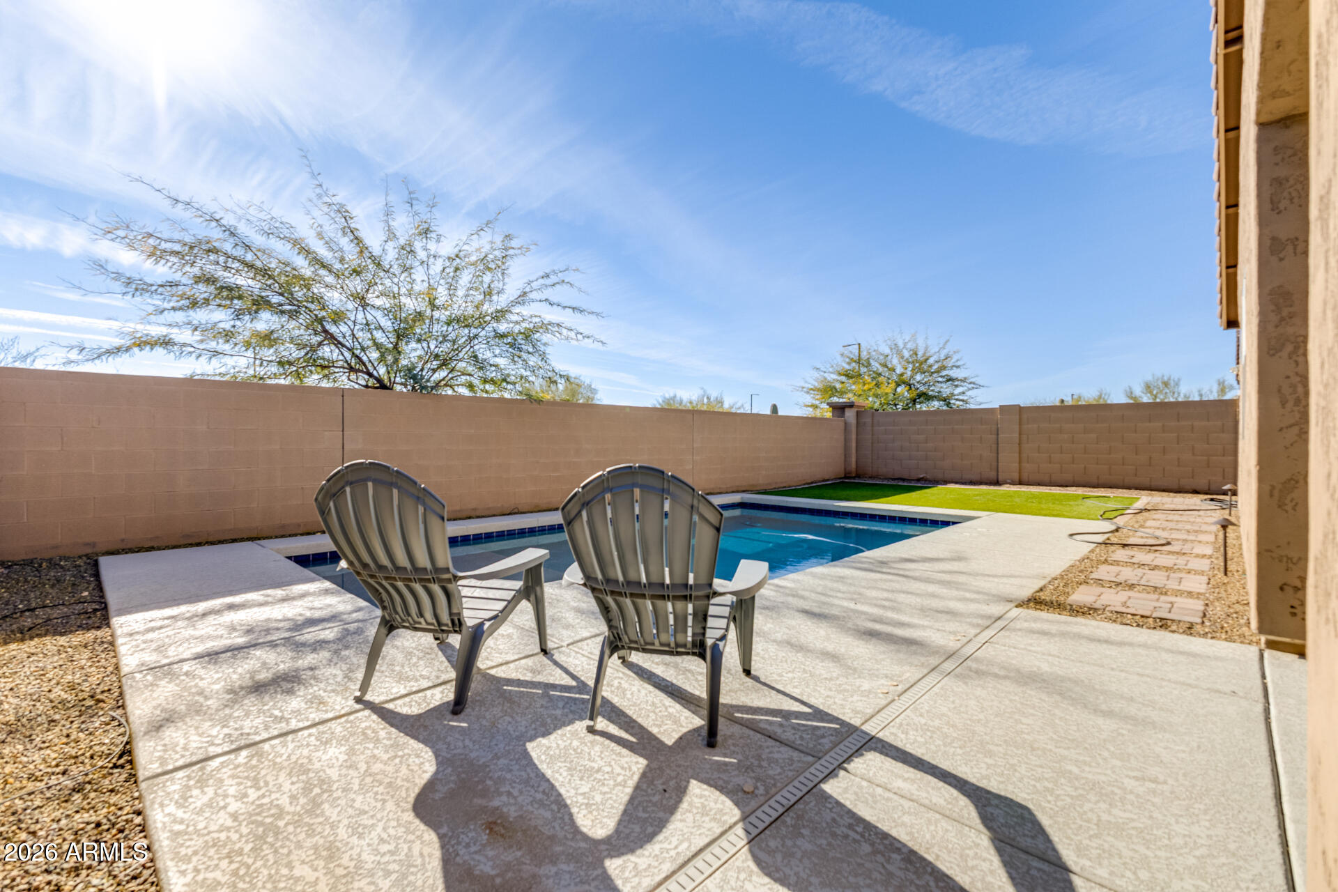 2929 West Laredo Lane Phoenix, AZ 85085 - Photo 28 of 28 a view of swimming pool with outdoor seating and plants