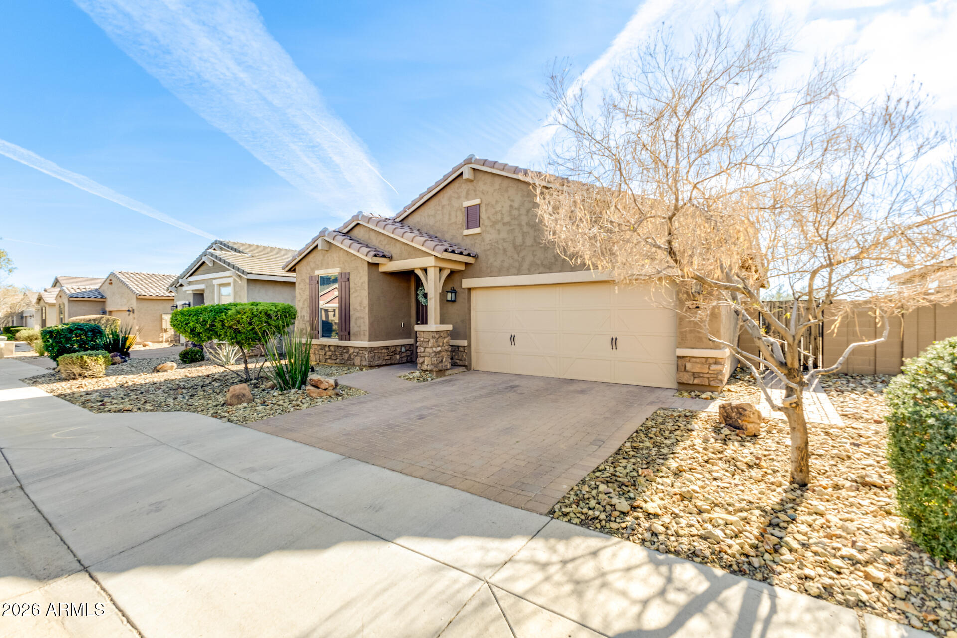 2929 West Laredo Lane Phoenix, AZ 85085 - Photo 3 of 28 a view of a white house with a large tree in front of it