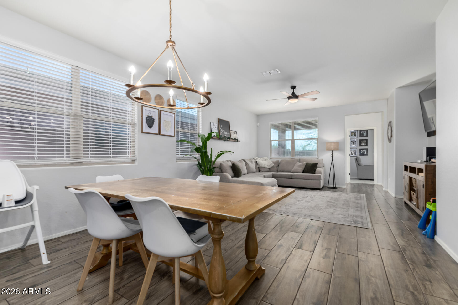 2929 West Laredo Lane Phoenix, AZ 85085 - Photo 8 of 28 a view of a dining room with furniture window and wooden floor