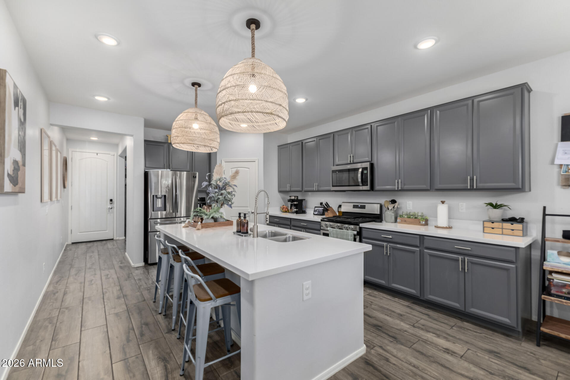 2929 West Laredo Lane Phoenix, AZ 85085 - Photo 10 of 28 a kitchen with stainless steel appliances a sink stove and refrigerator