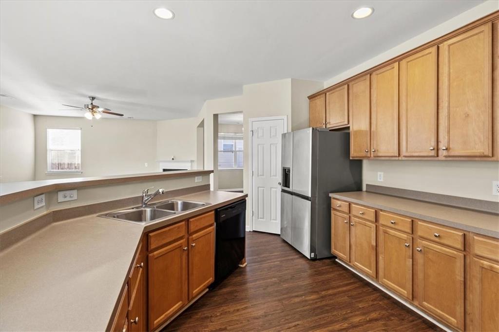 125 Parkmont Court Dallas, GA 30132 - Photo 16 of 36 a kitchen with stainless steel appliances granite countertop a sink stove and refrigerator
