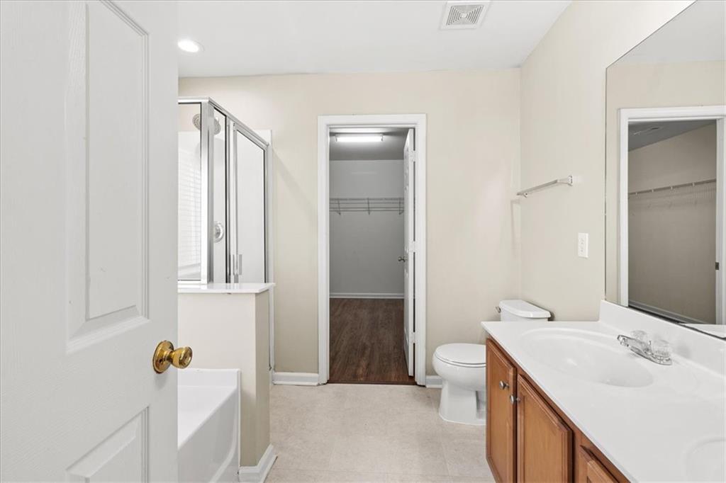 125 Parkmont Court Dallas, GA 30132 - Photo 25 of 36 a bathroom with a sink toilet and shower