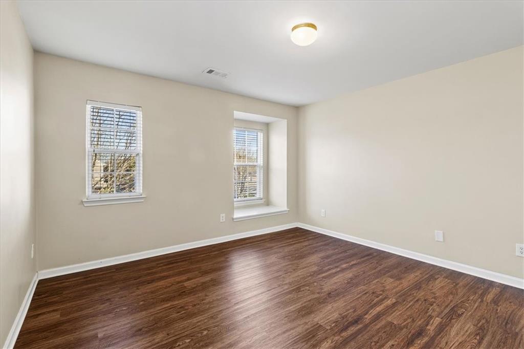 125 Parkmont Court Dallas, GA 30132 - Photo 29 of 36 a view of an empty room with wooden floor and a window