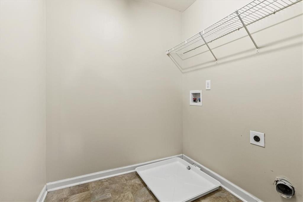 125 Parkmont Court Dallas, GA 30132 - Photo 31 of 36 a view of a room with racks on the wall