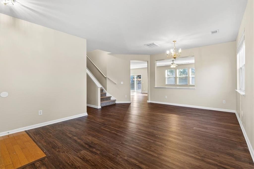 125 Parkmont Court Dallas, GA 30132 - Photo 8 of 36 an empty room with wooden floor and windows