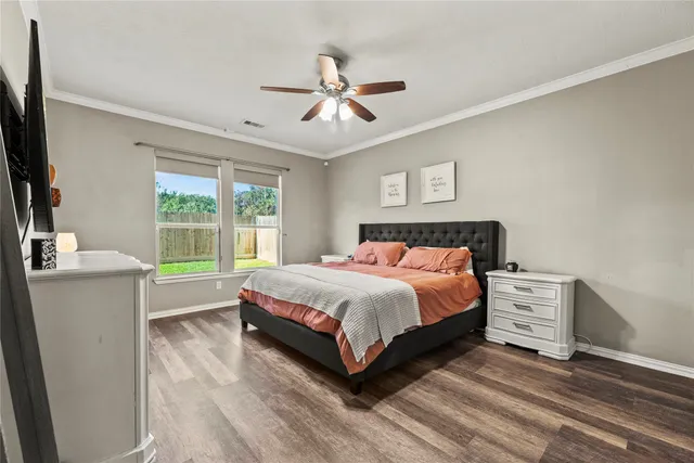 a bed room with a bed and a window