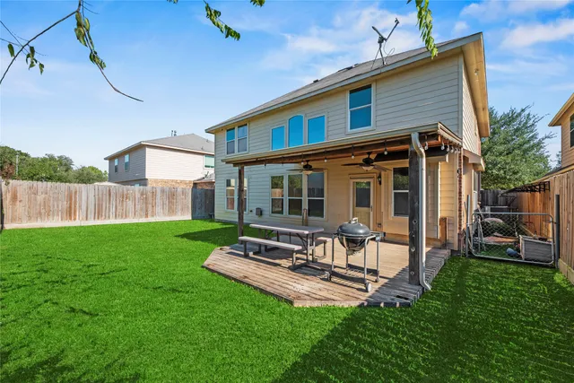 a front view of house with a garden and patio