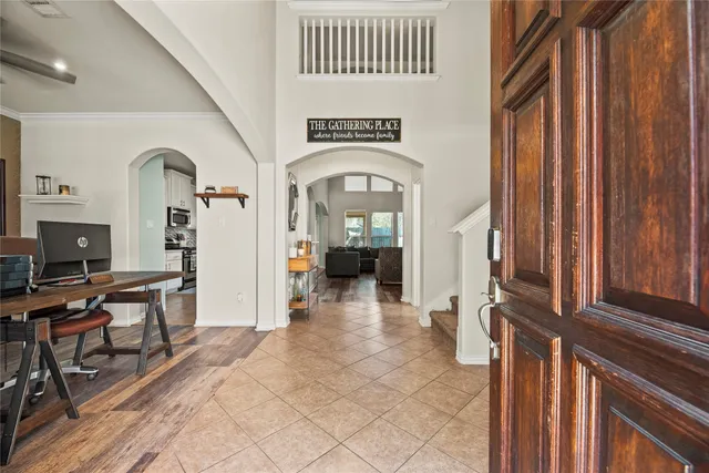 a view of a livingroom with furniture and front door