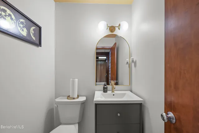 a workspace room with furniture and a potted plant