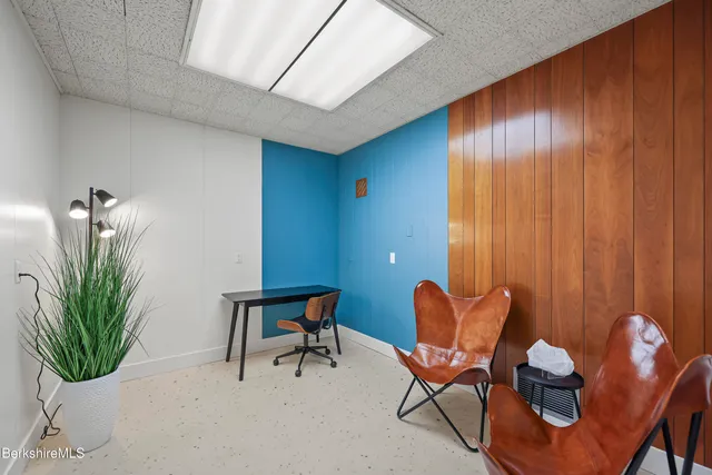 a room with furniture and a lamp