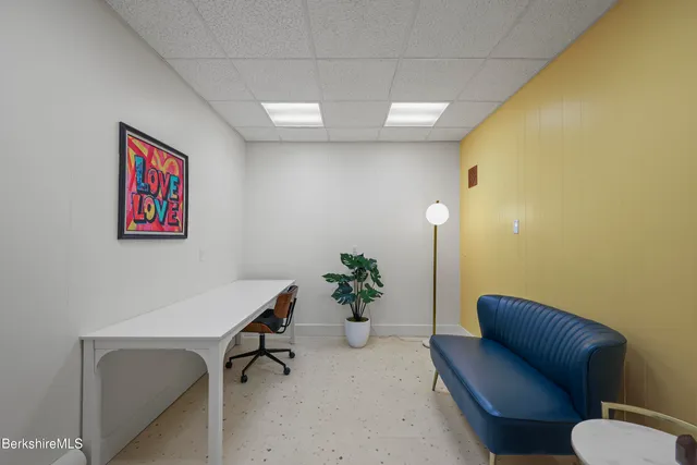 a workspace with furniture and a chair