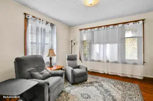 a dining room with furniture and window