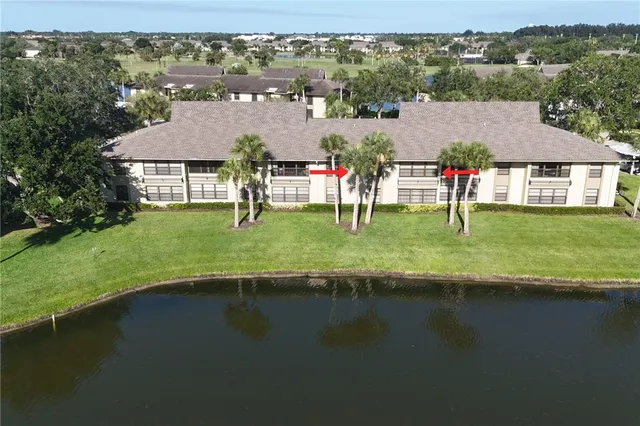 a view of a lake with a house in the background