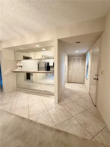 a view of a bathroom with a tub and shower