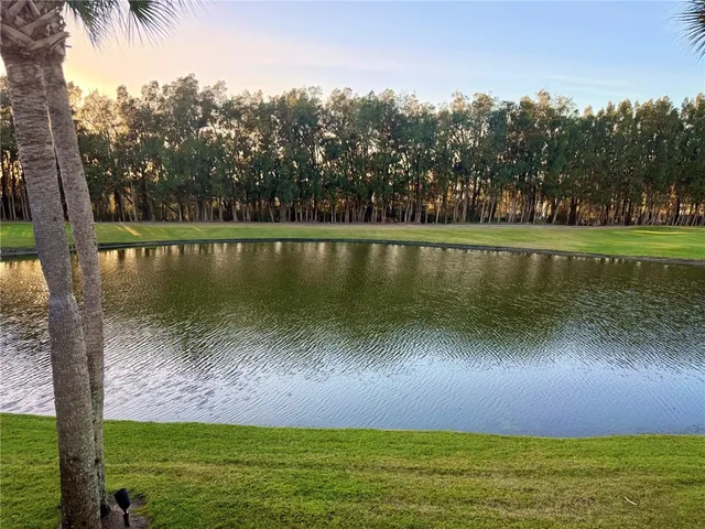 a view of a lake with a yard