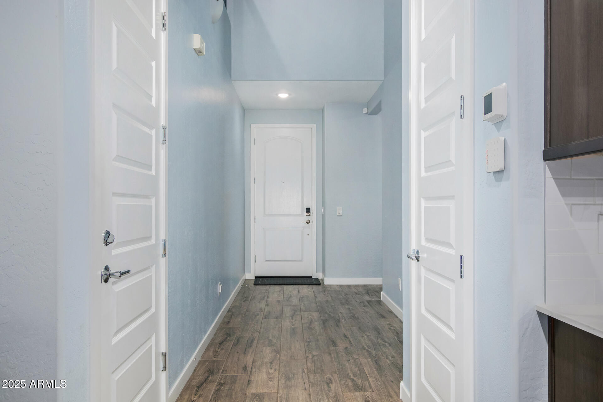 1171 East Armstrong Way Chandler, AZ 85286 - Photo 19 of 30 a view of a hallway with wooden floor and a bathroom