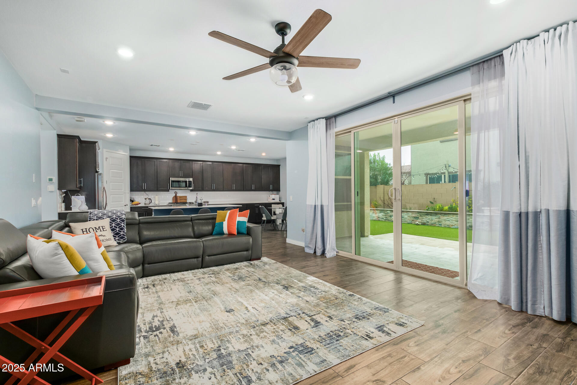 1171 East Armstrong Way Chandler, AZ 85286 - Photo 5 of 30 a living room with furniture and a flat screen tv