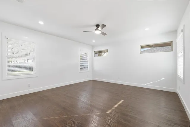 a spacious bathroom with a granite countertop sink and a mirror
