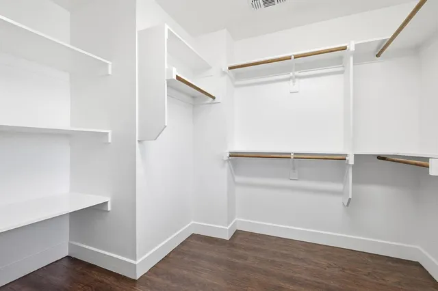 a view of an empty walk in closet