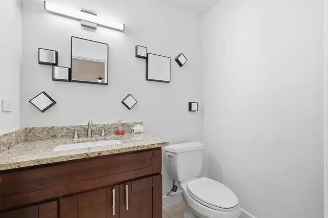 a view of garden with tall house