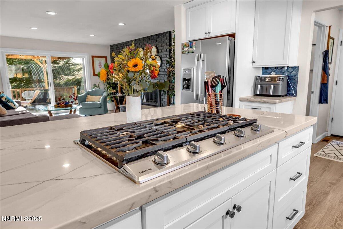 3880 Piccadilly Drive Reno, NV 89509 - Photo 16 of 58 a kitchen with stainless steel appliances granite countertop a stove and a refrigerator