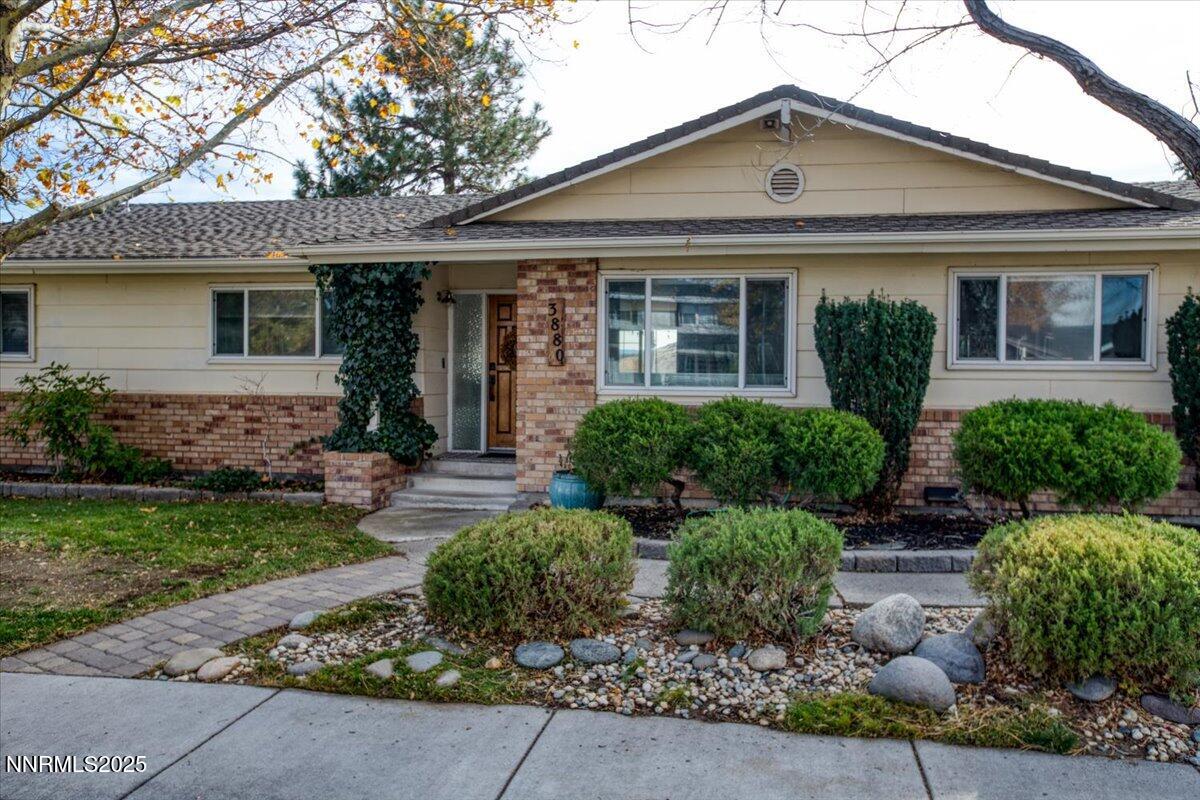 3880 Piccadilly Drive Reno, NV 89509 - Photo 2 of 58 front view of a house with a yard