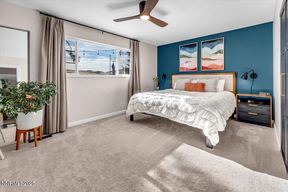 3880 Piccadilly Drive Reno, NV 89509 - Photo 25 of 58 a bedroom with a large bed and potted plant