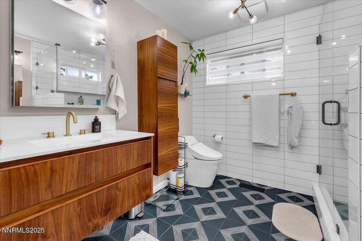 3880 Piccadilly Drive Reno, NV 89509 - Photo 28 of 58 a bathroom with a sink toilet and shower
