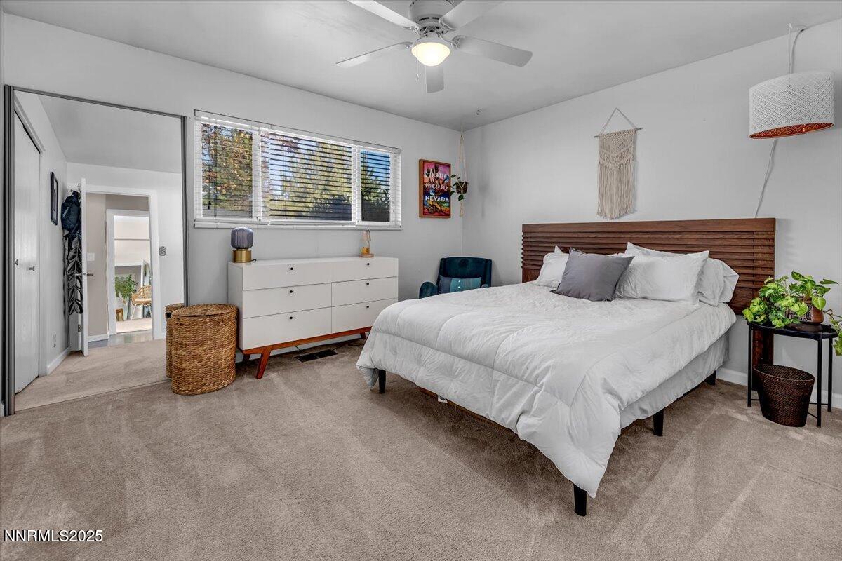 3880 Piccadilly Drive Reno, NV 89509 - Photo 31 of 58 a bedroom with a bed and a cabinets